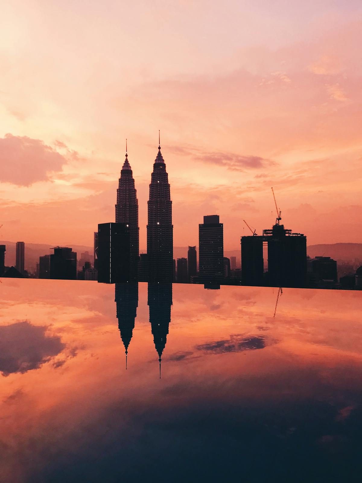 Sunset view from the Petronas Towers with orange sky over Kuala Lumpur