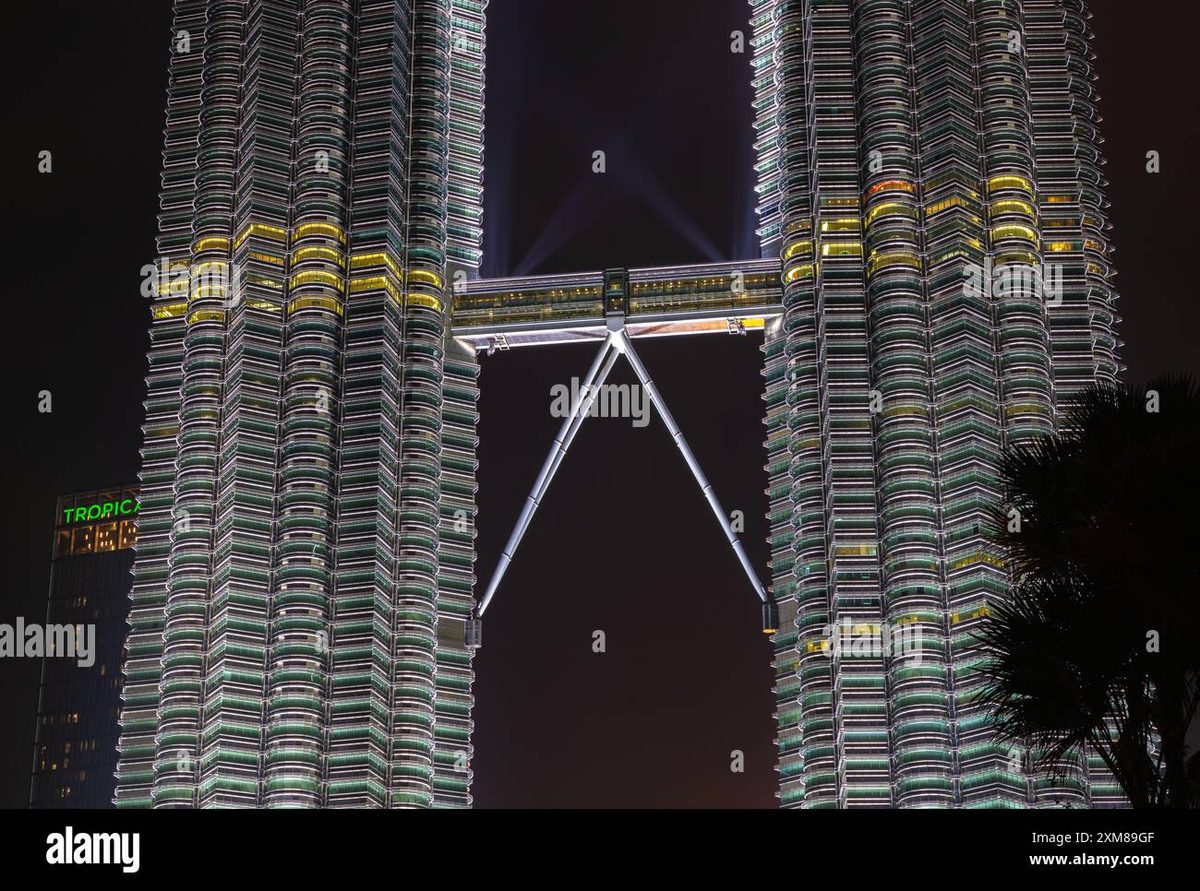 The Petronas Towers skybridge illuminated at night